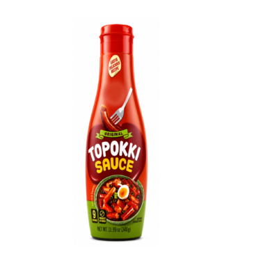 Maadan Topokki Sauce 11.99oz - Original Korean Rice Cake Flavor, a lady smiles with the sauce while cooking the toppoki - main image